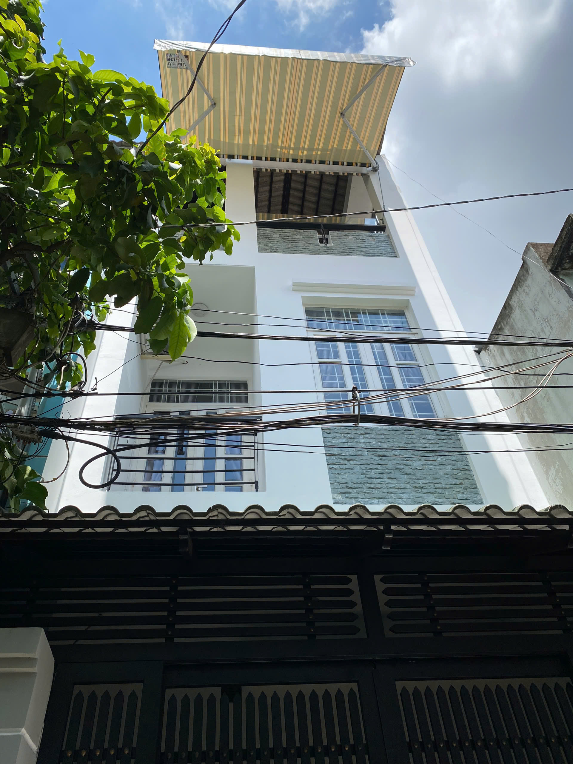 Nhà hẻm ô tô Quận 11, đối diện Đầm Sen. Diện tích 168m², thu nhập cho thuê 25 triệu/tháng. Sổ hồng - Ảnh chính